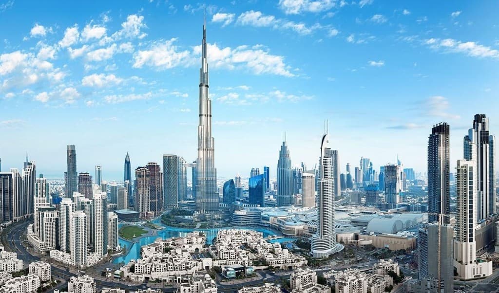 Panoramic skyline of Downtown Dubai and Burj Khalifa at sunset